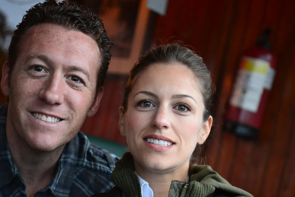 The honeymooning couple smiling together on their first night in Kenya